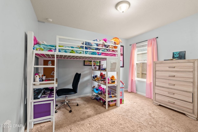 carpeted bedroom featuring a textured ceiling