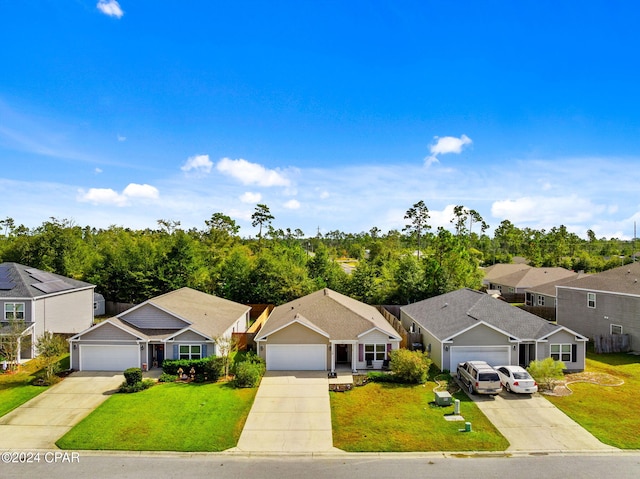 single story home featuring a front lawn and a garage