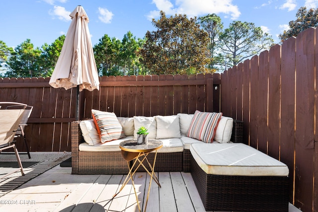 wooden terrace with outdoor lounge area