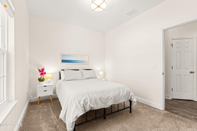 bedroom featuring wood-type flooring