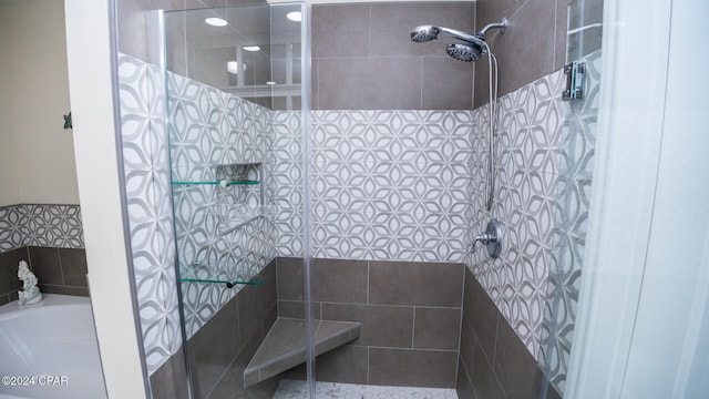 bathroom with tiled shower