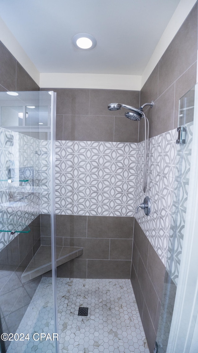 bathroom featuring tile patterned floors and walk in shower