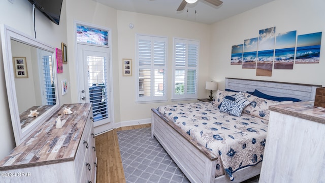 bedroom featuring ceiling fan and dark hardwood / wood-style floors