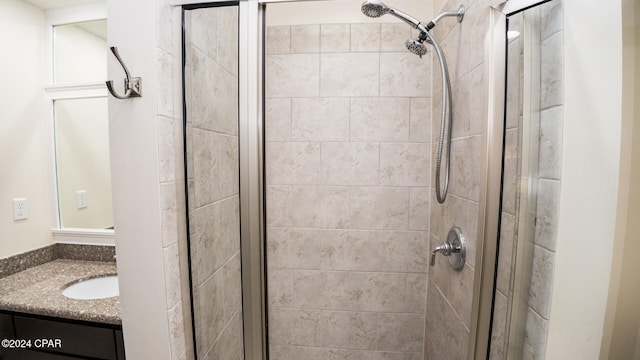 bathroom with vanity and an enclosed shower