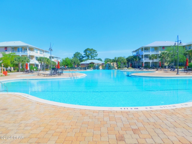 view of swimming pool featuring a patio