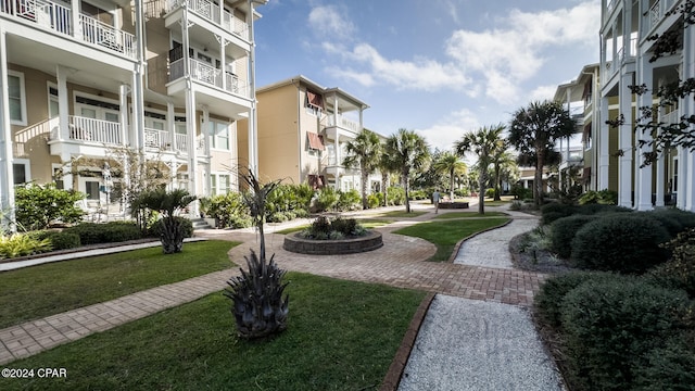 view of property's community featuring a yard