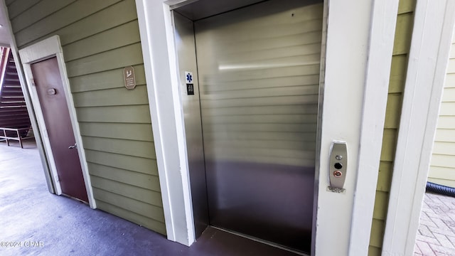 exterior details with wooden walls and elevator