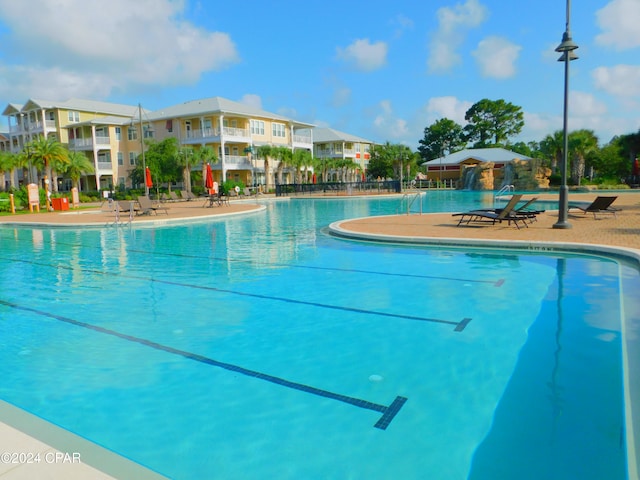 view of swimming pool with a patio