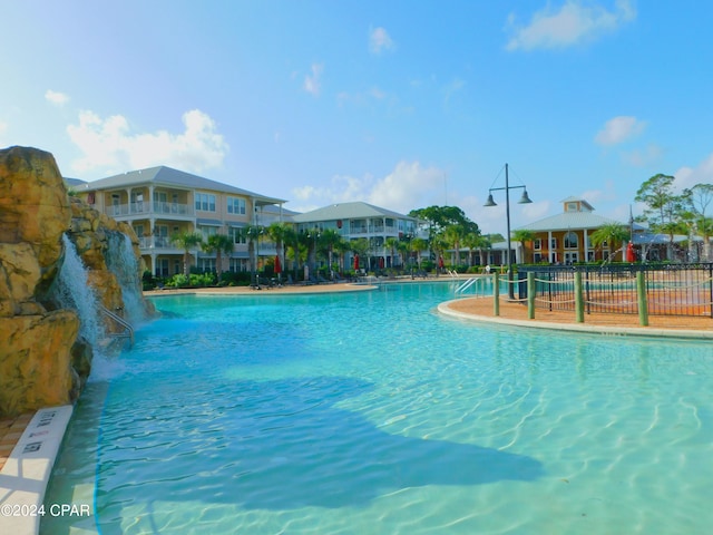 view of pool with pool water feature and a gazebo