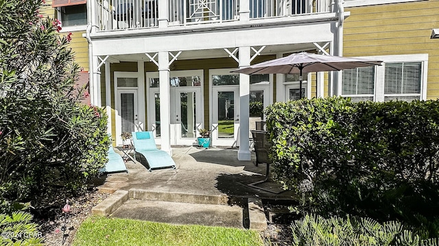 doorway to property featuring a patio and a balcony