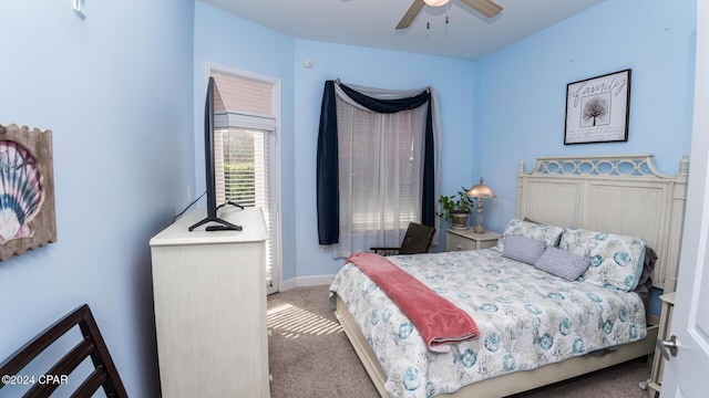 bedroom featuring ceiling fan, carpet flooring, and baseboards