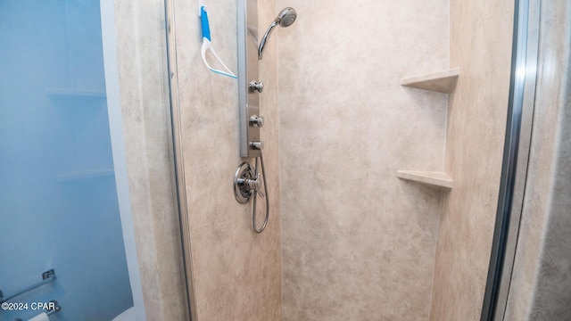 room details featuring a shower stall