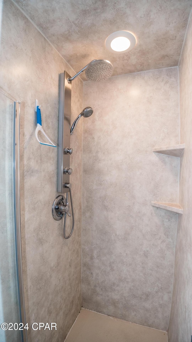 full bathroom with a stall shower