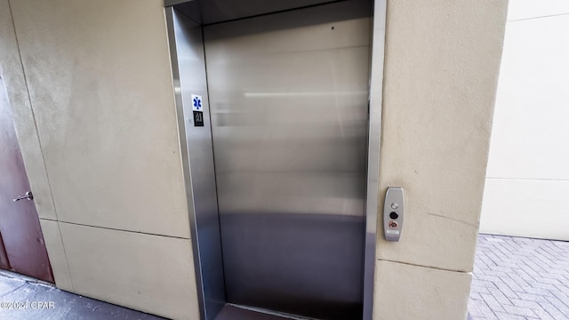 entrance to property featuring elevator