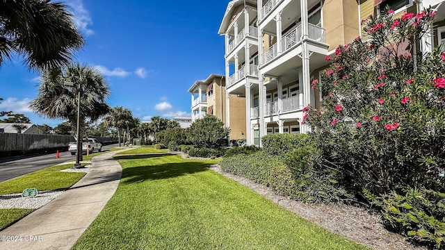 view of community featuring a residential view and a lawn