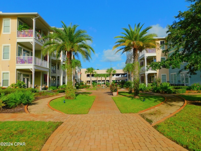 surrounding community featuring a yard