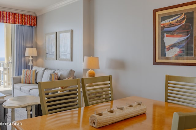 dining space with ornamental molding