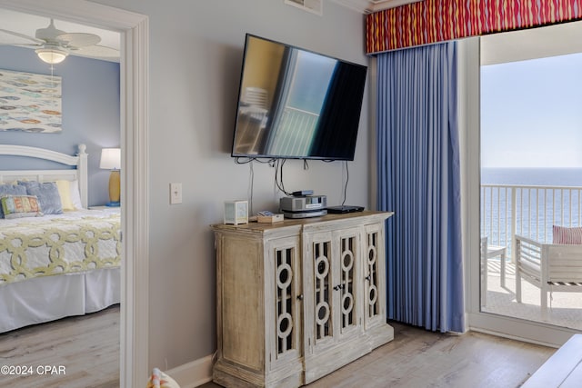 bedroom with ceiling fan and hardwood / wood-style floors