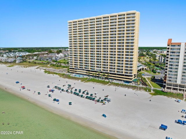 aerial view featuring a water view and a view of the beach