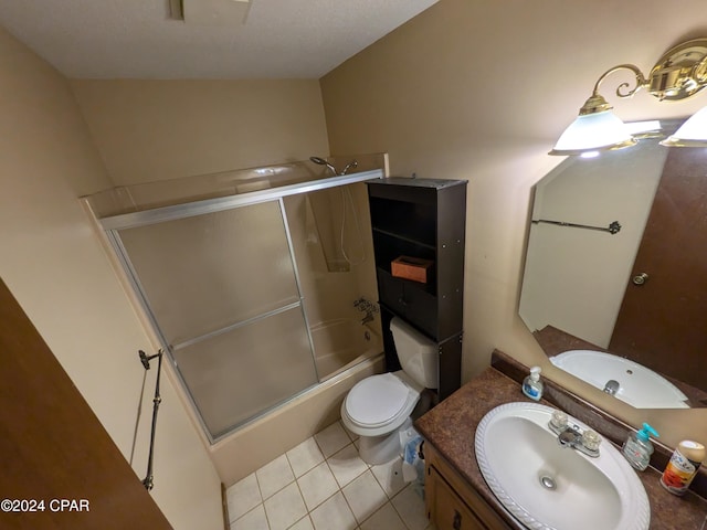 full bathroom with tile patterned flooring, vanity, toilet, and enclosed tub / shower combo