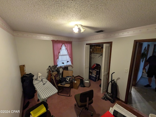 workout room with carpet and a textured ceiling