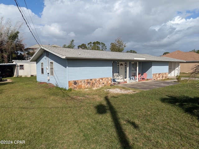 ranch-style house with a front lawn