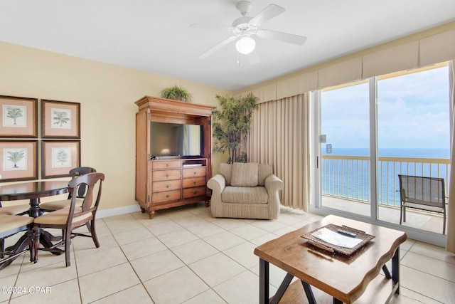 tiled living room featuring ceiling fan