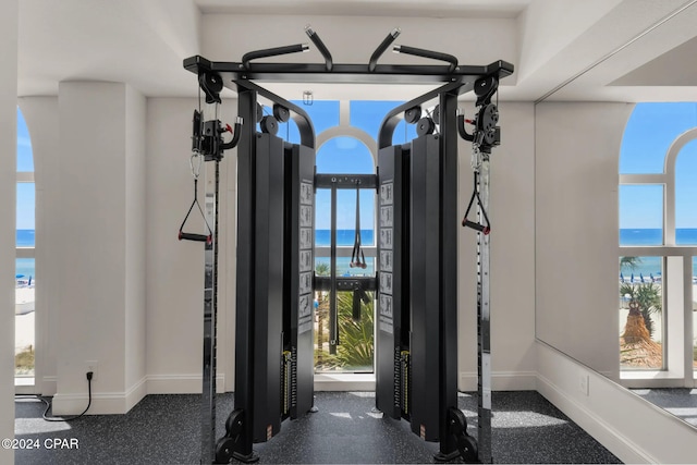 entryway with a water view and a healthy amount of sunlight