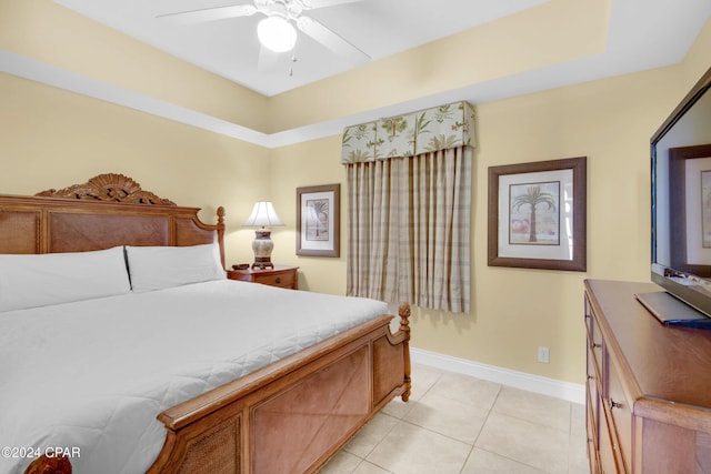 bedroom with ceiling fan and light tile patterned flooring