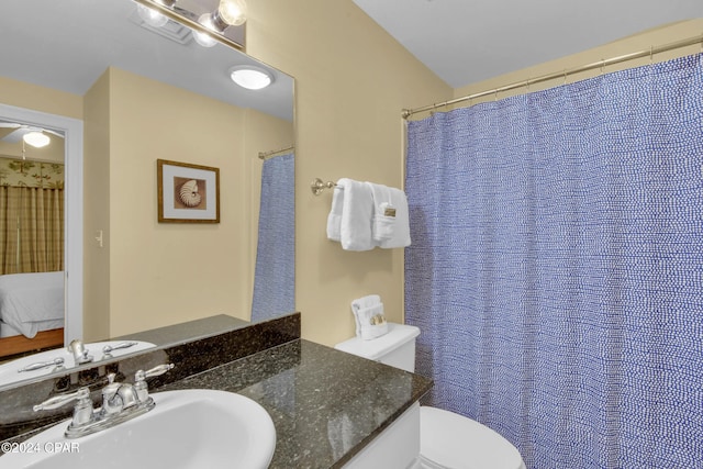 bathroom with vanity and toilet