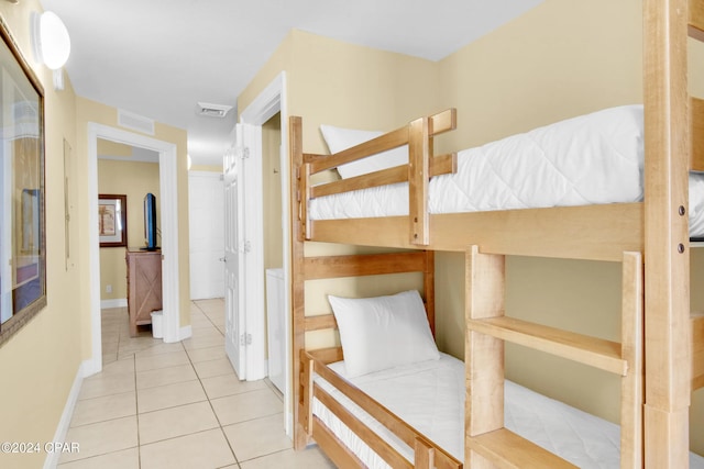 bedroom featuring light tile patterned floors