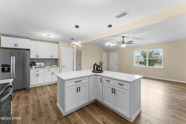 kitchen featuring beam ceiling, white cabinetry, stainless steel refrigerator with ice dispenser, pendant lighting, and light hardwood / wood-style floors