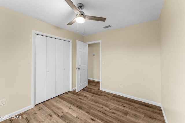 736 E Pine Forest Dr, Lynn Haven, FL 32444 - unfurnished bedroom with light wood-style flooring, baseboards, and a closet