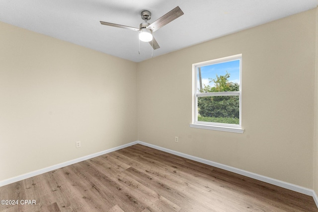 spare room with ceiling fan and light hardwood / wood-style floors