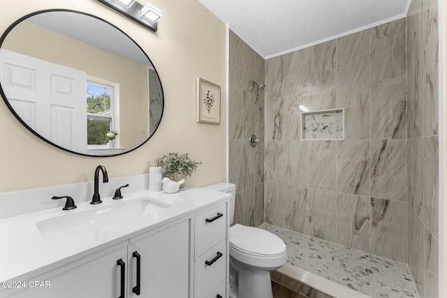 736 E Pine Forest Dr, Lynn Haven, FL 32444 - full bath featuring toilet, tiled shower, vanity, and a textured ceiling