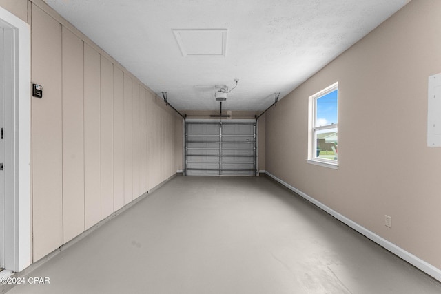 736 E Pine Forest Dr, Lynn Haven, FL 32444 - garage featuring baseboards and a garage door opener