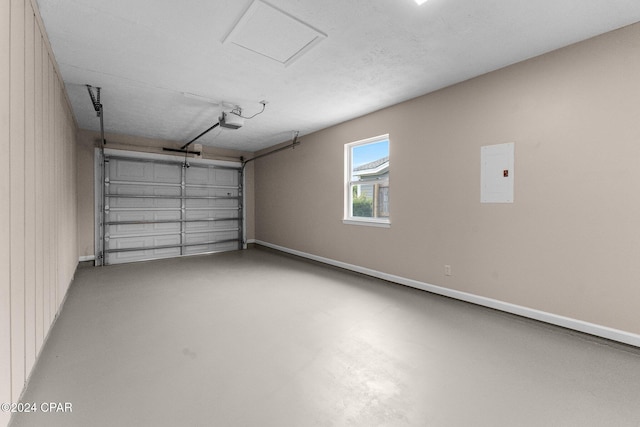 garage with wood walls and a garage door opener