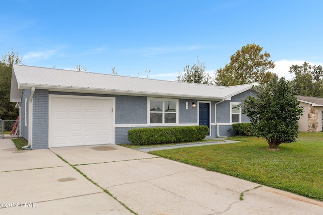 single story home featuring a front yard and a garage