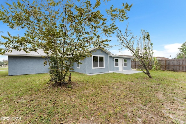 736 E Pine Forest Dr, Lynn Haven, FL 32444 - rear view of property with a patio area
