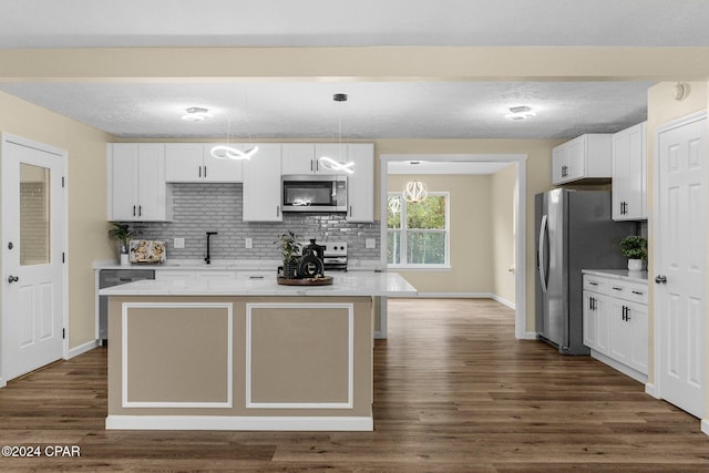 736 E Pine Forest Dr, Lynn Haven, FL 32444 - kitchen with stainless steel appliances, tasteful backsplash, dark wood-style floors, and light countertops