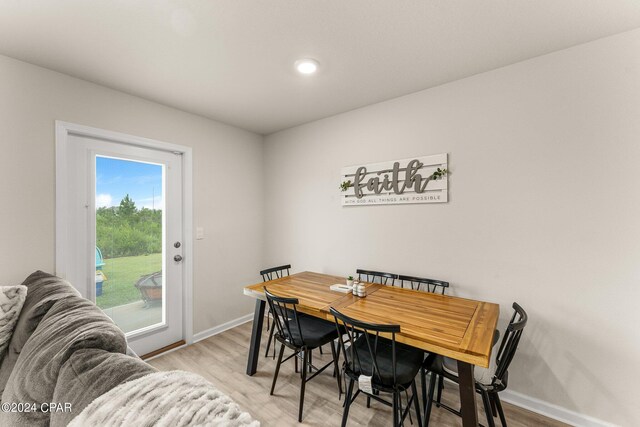 dining area with light hardwood / wood-style flooring