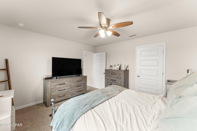 bedroom featuring ceiling fan and light carpet