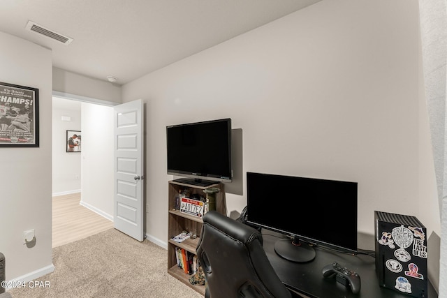 office area featuring light colored carpet