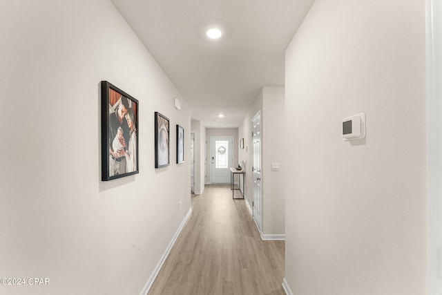 hall with light hardwood / wood-style flooring