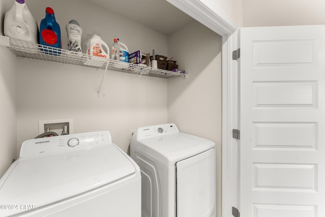 washroom with washer and clothes dryer