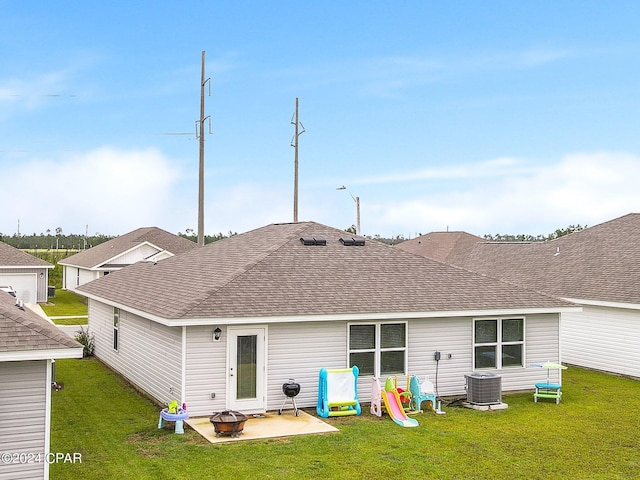 back of house with a yard, cooling unit, and a patio area