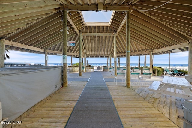 view of dock featuring a gazebo and a water view