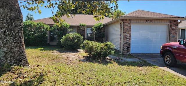 ranch-style home featuring a front lawn and a garage