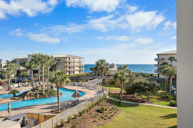 view of swimming pool with a water view