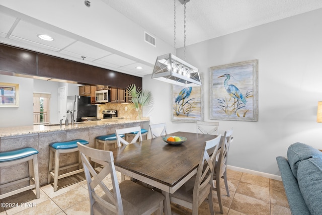 dining room with a textured ceiling